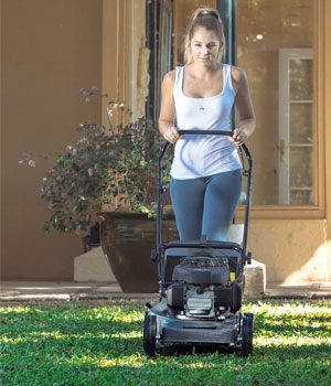 Bundaberg Mowers Sales - Woman mowing the lawn